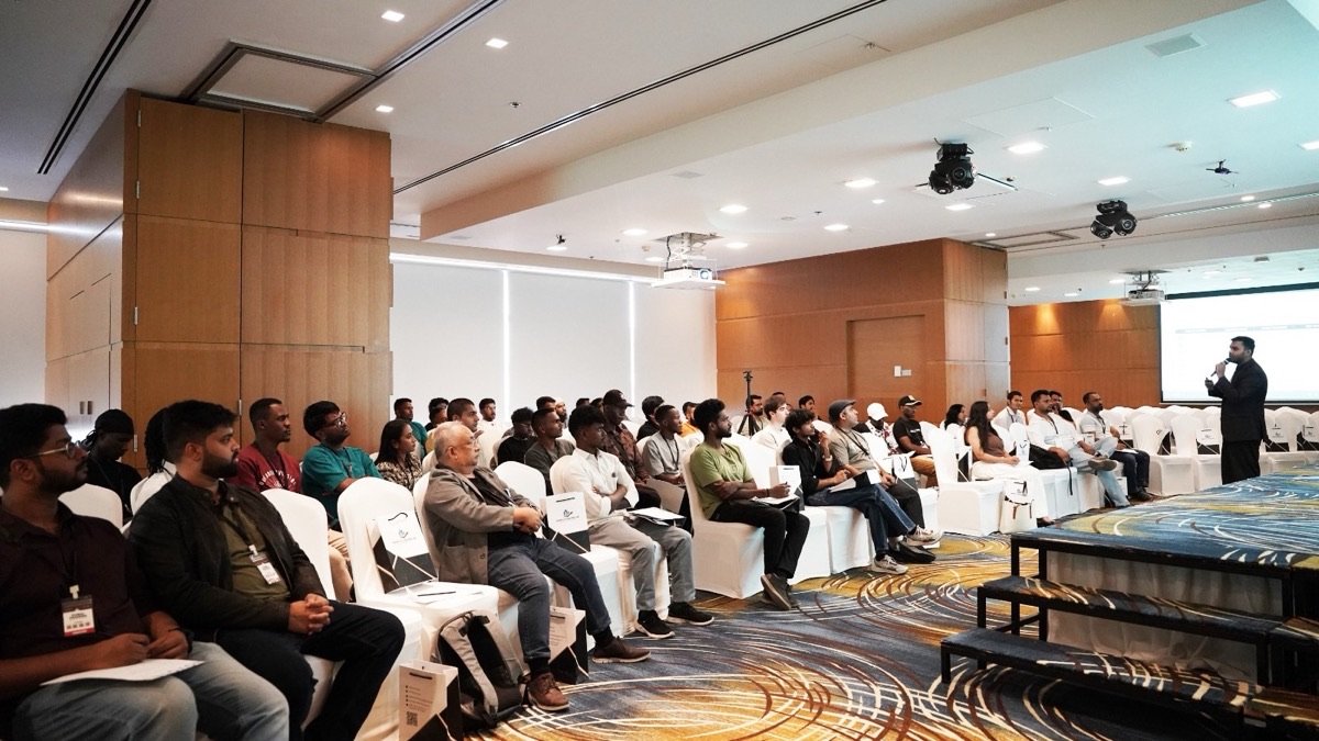 A GrowthX trainer presenting to a full room at a live seminar in Dubai